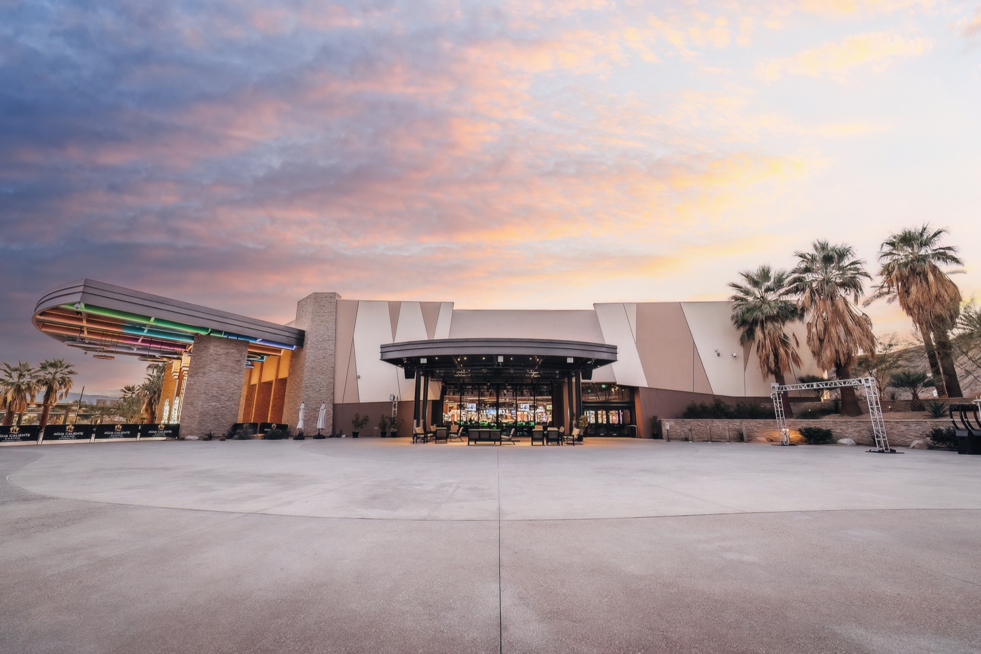 The Agave Caliente Terraza plaza at Agua Caliente Casino Cathedral City under a sunset sky